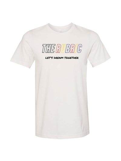 Front design of Let's Dream Shirt proudly displays The Rubric Book author, Sadé Diké's passionate phrase, "Let's Dream Together" where she calls on all to inspire and dream big together.